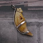 Very old Bear tooth carved in the form of a tiger seated on a pedestal. Handmade 925 Silver Pendant