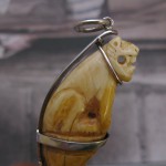 Very old Bear tooth carved in the form of a tiger seated on a pedestal. Handmade 925 Silver Pendant